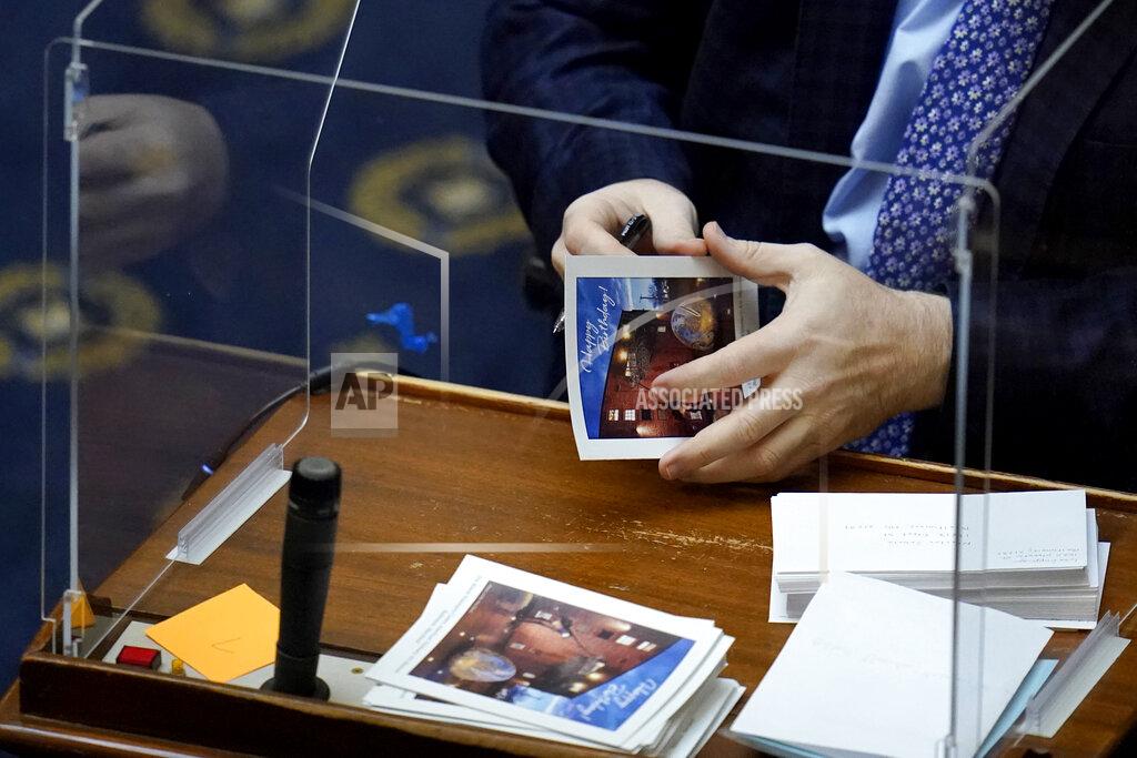 Julio Cortez Maryland Del. Luke Clippinger, D-Baltimore, signs birthday greeting cards during the first day of the state's 2021 legislative session, Wednesday, Jan. 13, 2021, in Annapolis, Md. (AP Photo/Julio Cortez)