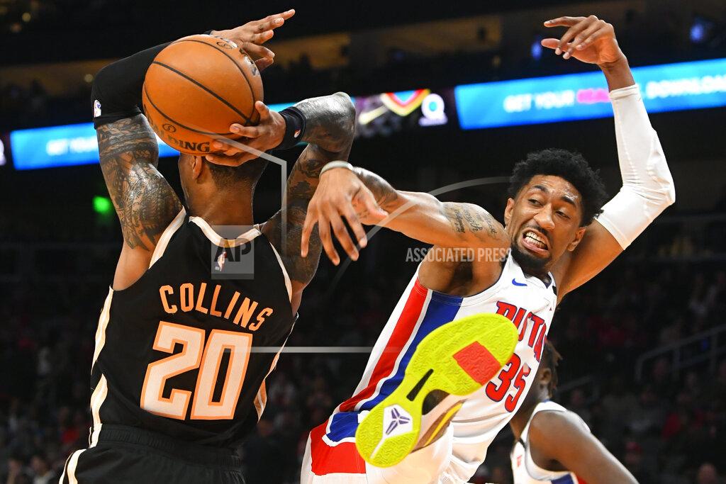 John Amis Detroit Pistons forward Christian Wood, right, comes down after blocking a shot by Atlanta Hawks forward John Collins (20) during the first half of an NBA basketball game Saturday, Jan. 18, 2020, in Atlanta. (AP Photo/John Amis)