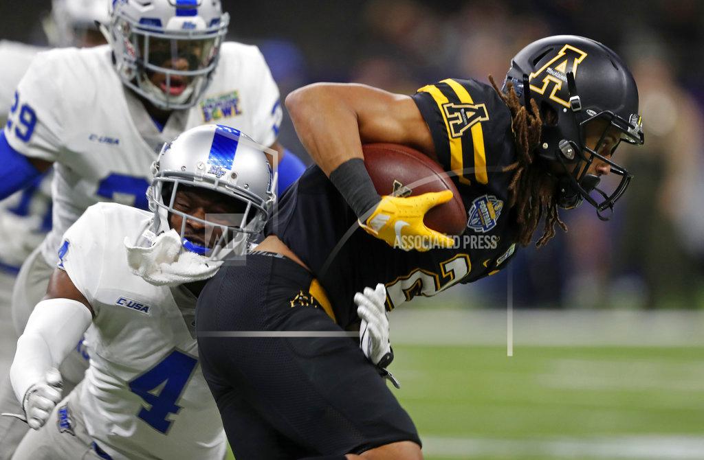 Gerald Herbert Appalachian State wide receiver Corey Xavier Sutton (2) runs against Middle Tennessee defensive back O.J. Johnson (4) in the first half of the New Orleans Bowl NCAA college football game in New Orleans, Saturday, Dec. 15, 2018. (AP Photo/Gerald Herbert)