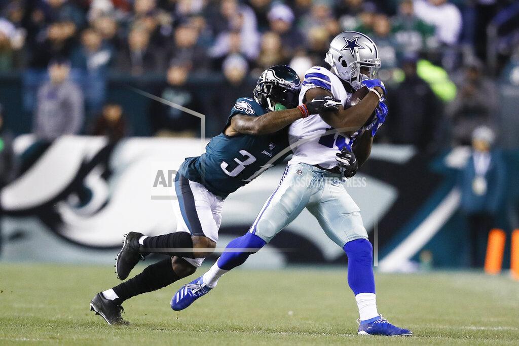 Dallas Cowboys wide receiver Michael Gallup, right, catches a pass as Philadelphia Eagles cornerback Jalen Mills defends during the first half of an NFL football game Sunday, Dec. 22, 2019, in Philadelphia. (AP Photo/Michael Perez)
