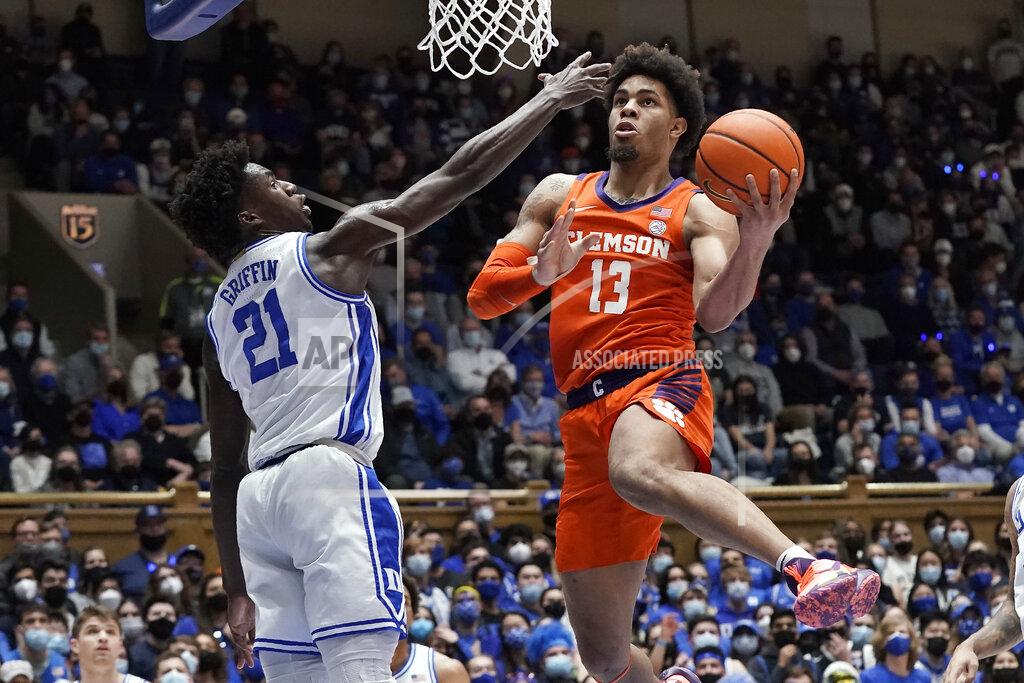 Gerry Broome Clemson guard David Collins (13) drives to the basket while Duke forward A.J. Griffin (21) defends during the first half of an NCAA college basketball game in Durham, N.C., Tuesday, Jan. 25, 2022. (AP Photo/Gerry Broome)