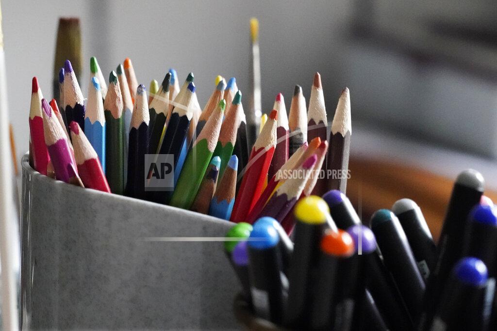 Charles Krupa Colored pencils, sharpened and at the ready, rest in a container on the desk of artist Robert Seaman in his room at an assisted living facility Monday, May 10, 2021, in Westmoreland, N.H. Seaman, who moved into the facility weeks before the COVID-19 pandemic shutdown his outside world in 2020, recently completed his 365th daily sketch, or what he calls his "Covid Doodles", since being isolated due to the virus outbreak. (AP Photo/Charles Krupa)