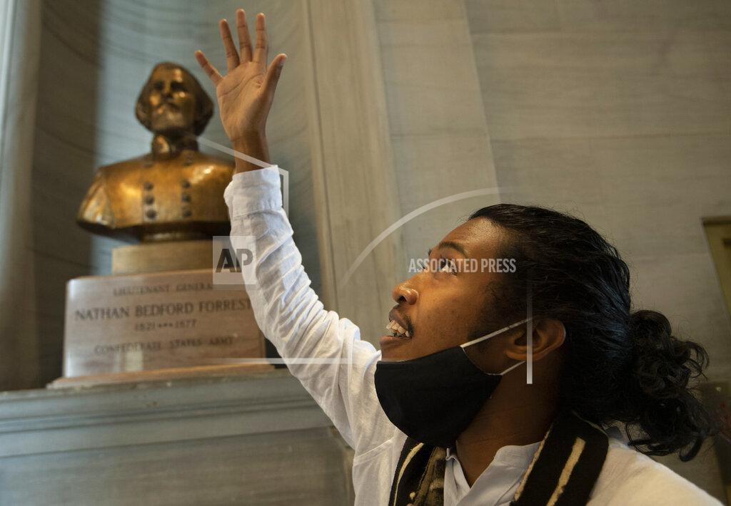 George Walker Iv Activist Justin Jones gives praise to God in front of the Nathan Bedford Forrest bust in the State Capitol Thursday, July 22, 2021 in Nashville, Tenn., after the removal of the bust was approved by by the State Building Commission. Jones led protests over the summer of 2020 to have the bust removed. A decadeslong effort to remove the bust from the Tennessee Capitol cleared its final hurdle Thursday, with state leaders approving the final vote needed to allow the statue to be relocated to a museum. (George Walker IV/The Tennessean via AP)