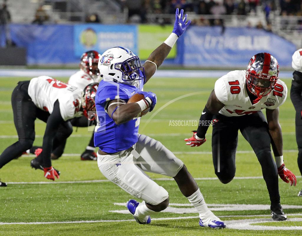 Mark Humphrey Middle Tennessee running back Chaton Mobley, center, falls after being hit by Western Kentucky defensive lineman DeAngelo Malone (10) in the first half of an NCAA college football game Friday, Nov. 2, 2018, in Murfreesboro, Tenn. (AP Photo/Mark Humphrey)