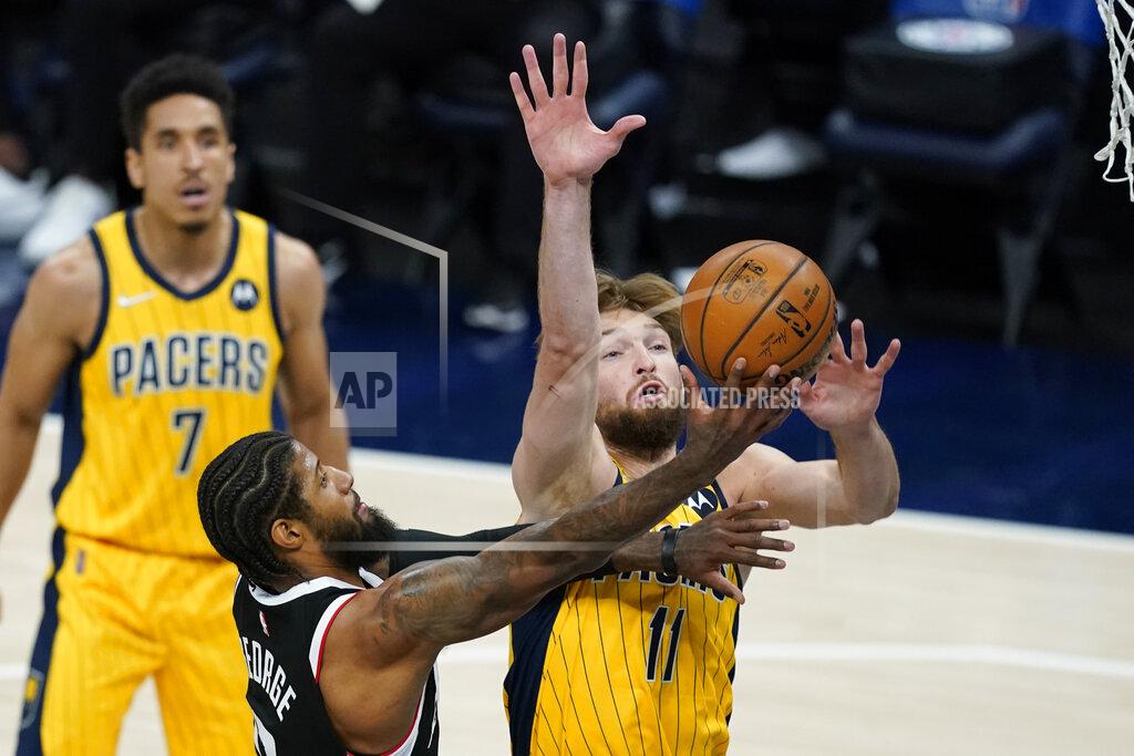 Darron Cummings Los Angeles Clippers' Paul George (13) puts up a shot against Indiana Pacers' Domantas Sabonis (11) during the first half of an NBA basketball game, Tuesday, April 13, 2021, in Indianapolis. (AP Photo/Darron Cummings)