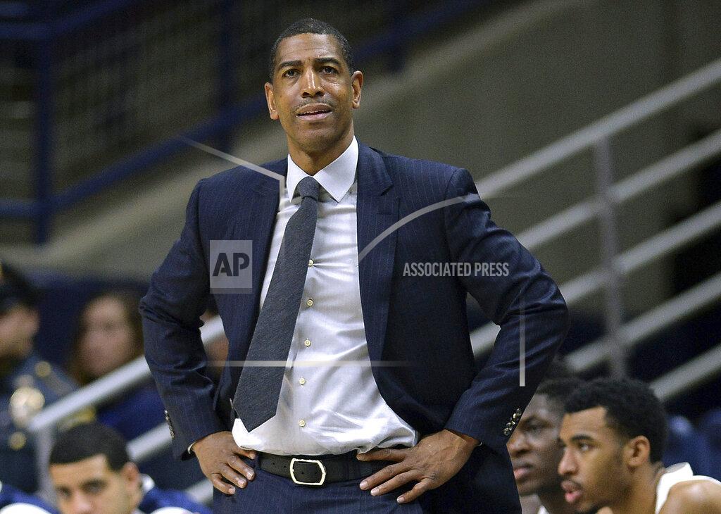 FILE - In this Feb. 7, 2018, file photo, Connecticut head coach Kevin Ollie watches from the sideline during the first half an NCAA college basketball game in Storrs, Conn. A federal judge dismissed a complaint on Tuesday, Feb. 5, 2019, filed by Ollie connected to his allegations that his firing was in part racially motivated, deciding the complaint was filed prematurely. The judge did not rule on the merits of the request. (AP Photo/Jessica Hill, File)