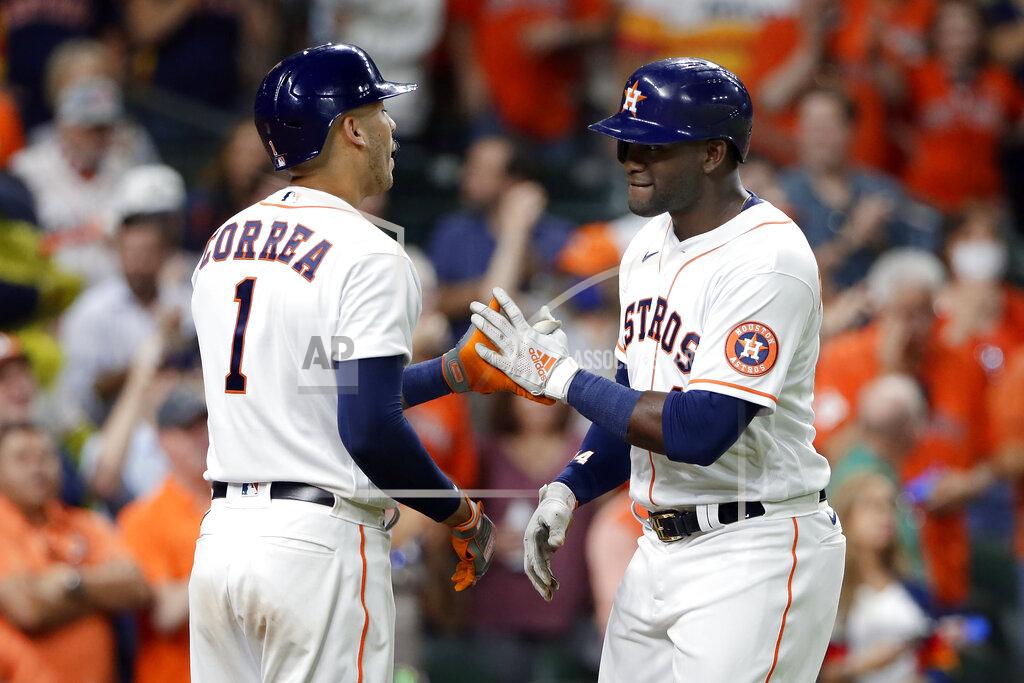 Michael Wyke Houston Astros' Carlos Correa (1) and Yordan Alvarez, right, celebrate Alvarez's home run against the Oakland Athletics during the sixth inning of a baseball game Thursday, April 8, 2021, in Houston. (AP Photo/Michael Wyke)