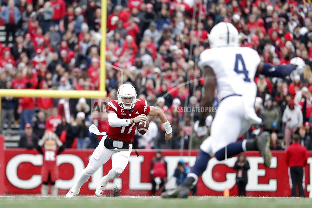 Julio Cortez Rutgers quarterback Giovanni Rescigno (17) runs with the ball as Penn State safety Nick Scott (4) moves in during the second half of an NCAA college football game, Saturday, Nov. 17, 2018, in Piscataway, N.J. (AP Photo/Julio Cortez)