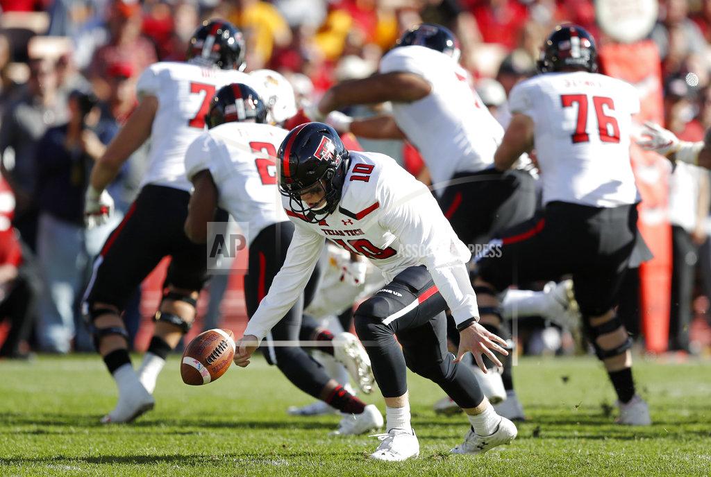Charlie Neibergall Texas Tech quarterback Alan Bowman recovers a fumbled snap during the second half of an NCAA college football game against Iowa State, Saturday, Oct. 27, 2018, in Ames, Iowa. Iowa State won 40-31. (AP Photo/Charlie Neibergall)