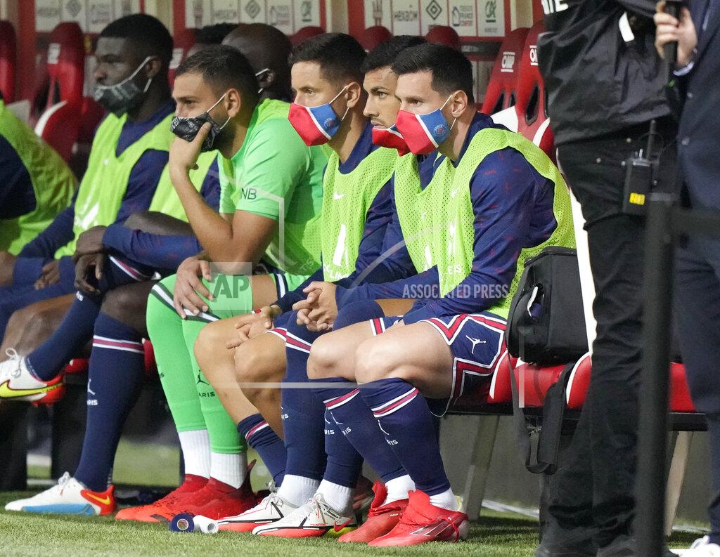 Francois Mori PSG's Lionel Messi, right, sits on the bench prior to the France League One soccer match between Reims and Paris Saint-Germain, at the Stade Auguste-Delaune in Reims, France, Sunday, Aug. 29, 2021. (AP Photo/Francois Mori)