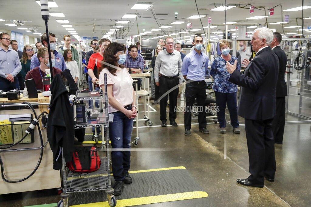 Morry Gash Vice President Mike Pence talks to workers at the GE Healthcare manufacturing facility Tuesday April 21, 2020, in Madison, Wis. (AP Photo/Morry Gash)