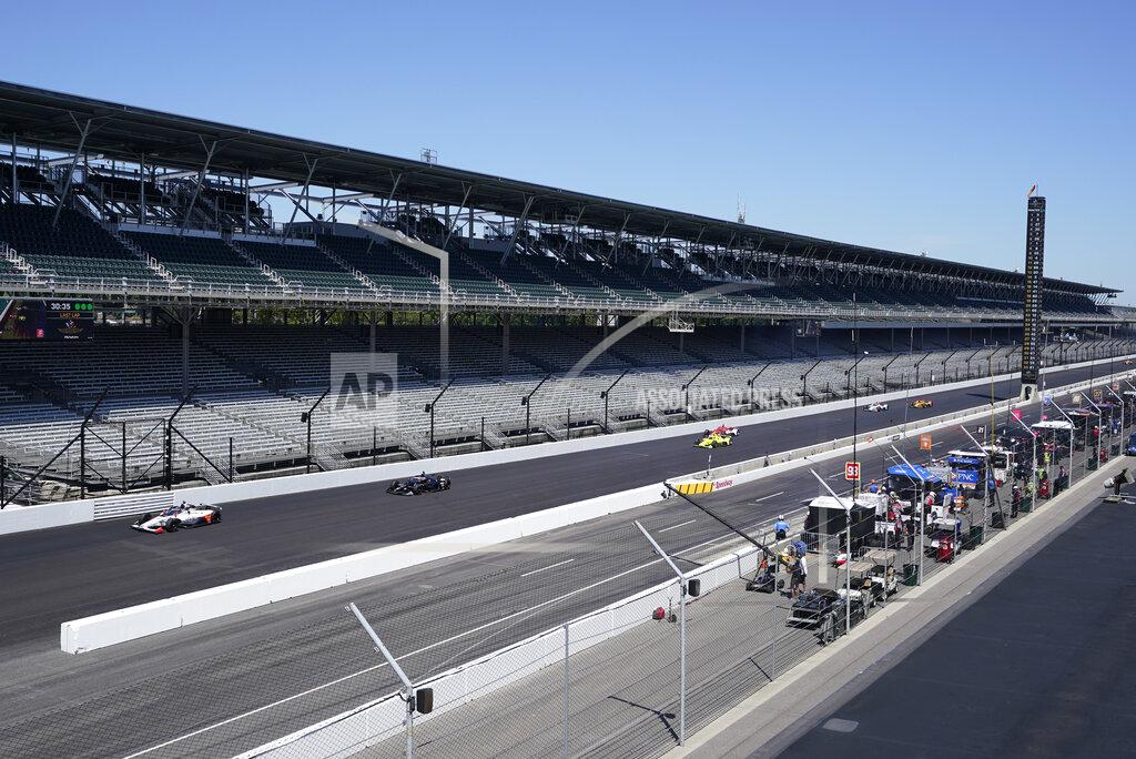 Darron Cummings Cars drive down the main straight-a-way during the final practice session for the Indianapolis 500 auto race at Indianapolis Motor Speedway, Friday, Aug. 21, 2020, in Indianapolis. (AP Photo/Darron Cummings)