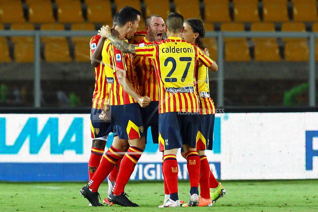 Donato Fasano Lecce's Fabio Lucioni, center, celebrates after scoring his side's 2nd goal during the Serie A soccer match between Lecce and Lazio at the Stadio del Mare in Lecce, Italy, Tuesday, July 7, 2020. (Donato Fasano/LaPresse via AP)