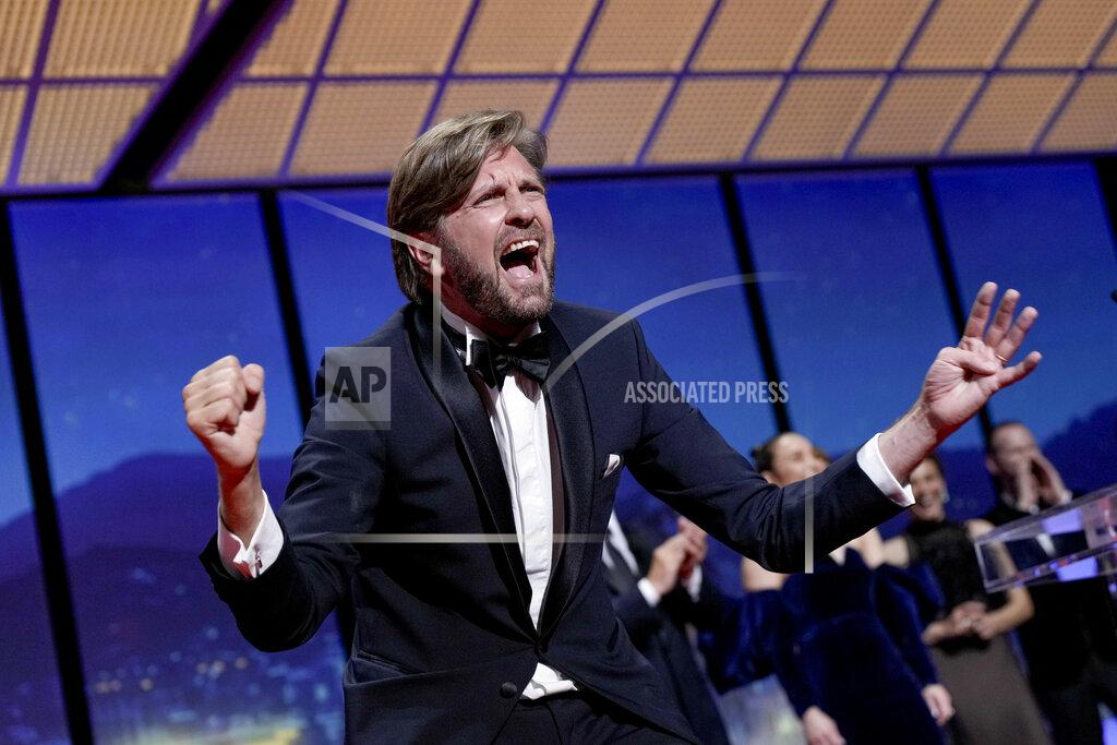 Joel C Ryan Writer/director Ruben Ostlund celebrates after winning the Palme d'Or for 'Triangle of Sadness' during the awards ceremony of the 75th international film festival, Cannes, southern France, Saturday, May 28, 2022. (Photo by Joel C Ryan/Invision/AP)