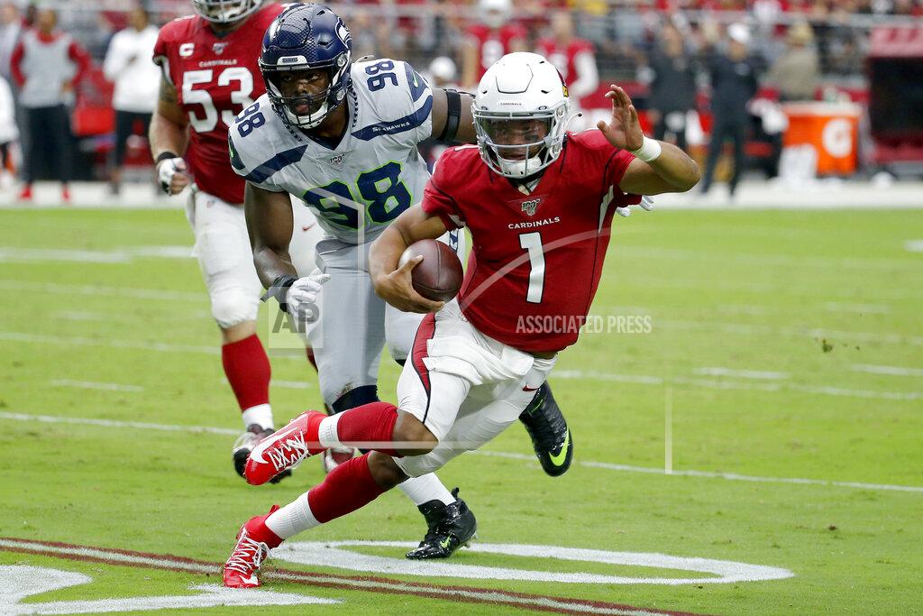 Rick Scuteri Arizona Cardinals quarterback Kyler Murray (1) scrambles as Seattle Seahawks defensive end Rasheem Green (98) pursues during the first half of an NFL football game, Sunday, Sept. 29, 2019, in Glendale, Ariz. (AP Photo/Rick Scuteri)