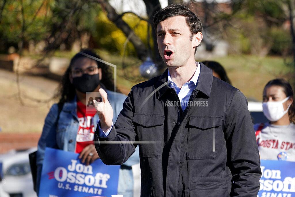Democratic nominee for U.S. Senate from Georgia Jon Ossoff speaks after voting early in Atlanta on Tuesday, Dec. 22, 2020. For the second time in three years, Jon Ossoff is campaigning in overtime. The question is whether the 33-year-old Democrat can deliver a win in a crucial Jan. 5 runoff with Republican Sen. David Perdue. (AP Photo/John Bazemore)