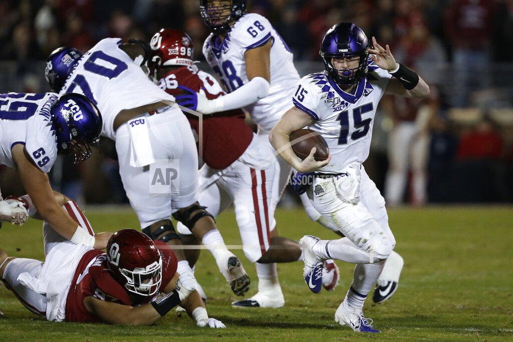 Sue Ogrocki TCU quarterback Max Duggan (15) carries in the first half of an NCAA college football game against Oklahoma in Norman, Okla., Saturday, Nov. 23, 2019. (AP Photo/Sue Ogrocki)