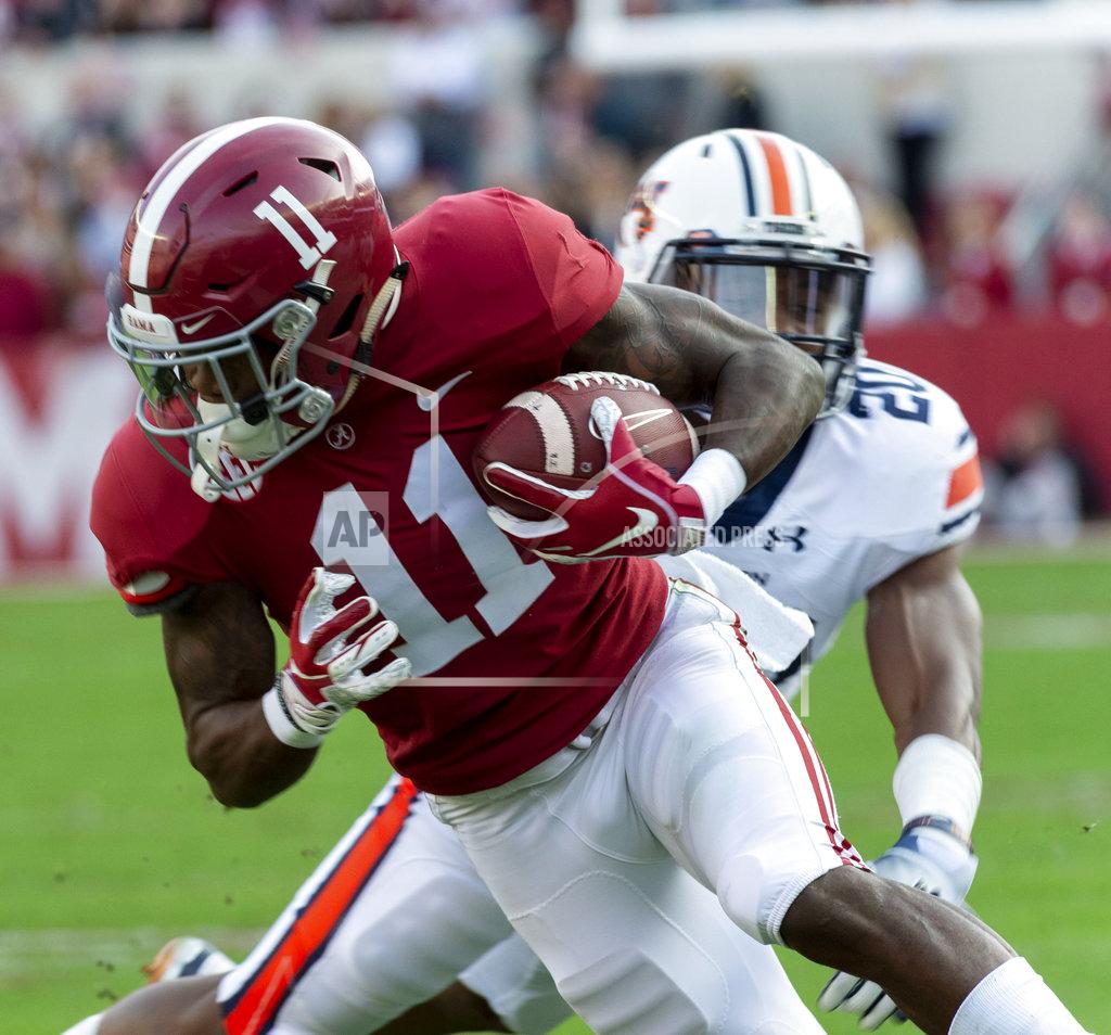Vasha Hunt Alabama wide receiver Henry Ruggs III (11) works by Auburn defensive back Jeremiah Dinson (20) during the first half of an NCAA college football game, Saturday, Nov. 24, 2018, in Tuscaloosa, Ala. (AP Photo/Vasha Hunt)