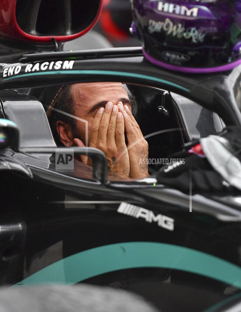 Joe Klamar Mercedes driver Lewis Hamilton of Britain reacts in his car after winning the Hungarian Formula One Grand Prix at the Hungaroring racetrack in Mogyorod, Hungary, Sunday, July 19, 2020. (Joe Klamar/Pool via AP)