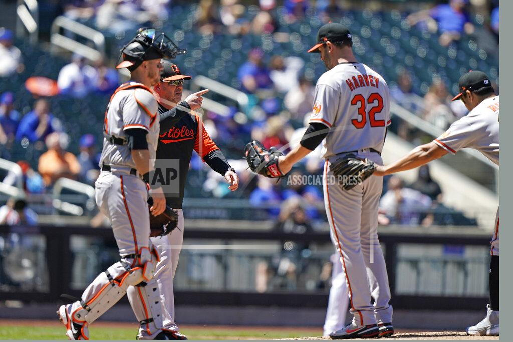 Kathy Willens Baltimore Orioles manager Brandon Hyde points to the bullpen as he comes to take Orioles starting pitcher Matt Harvey (32) from the mound during the fifth inning of a baseball game against the New York Mets, Wednesday, May 12, 2021, in New York. (AP Photo/Kathy Willens)
