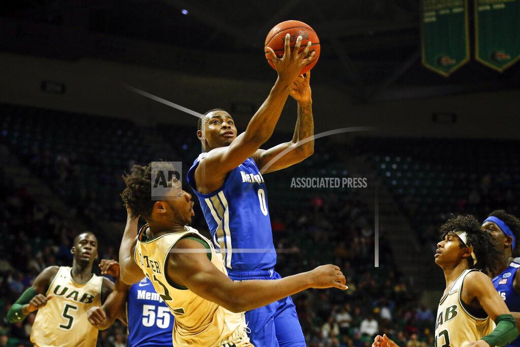 Butch Dill Memphis forward D.J. Jeffries (0) puts up a shot over UAB forward Will Butler (12) during the second half of an NCAA college basketball game Saturday, Dec. 7, 2019, in Birmingham, Ala. (AP Photo/Butch Dill)