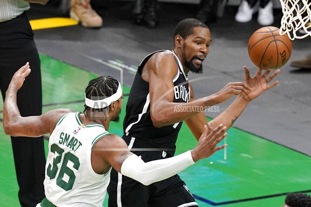 Elise Amendola Brooklyn Nets forward Kevin Durant, right, is fouled by Boston Celtics guard Marcus Smart, left, as he goes to the hoop in the second half of Game 4 during an NBA basketball first-round playoff series, Sunday, May 30, 2021, in Boston. (AP Photo/Elise Amendola)