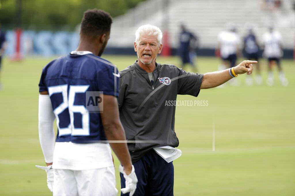 Mark Humphrey FILE -Tennessee Titans secondary coach Kerry Coombs talks with defensive back Logan Ryan (26) during NFL football training camp Friday, July 27, 2018, in Nashville, Tenn. Deposed Ohio State defensive coordinator Kerry Coombs will be the new special teams/cornerbacks coach for Luke Fickell at the University of Cincinnati. Fickell announced the hiring of the 60-year-old Coombs on Tuesday, Feb. 1, 2022. (AP Photo/Mark Humphrey, File)