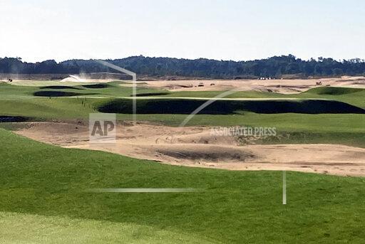 This Sept. 27, 2021 photo shows The Lido Golf Club under construction at Sand Valley Golf Resort in Nekoosa, Wis. The course was designed through old photos and documents, with the help of a course-building video game. The Lido will be an exact restoration of an abandoned course of the same name on Long Island, long considered one of the best golf courses in the world. (AP Photo/John Marshall)