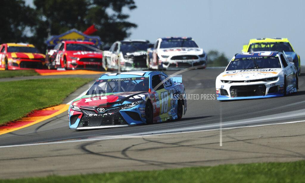 John Munson Kyle Busch (18) heads out of the Bus Stop during a NASCAR Cup Series auto race at Watkins Glen International, Sunday, Aug. 4, 2019, in Watkins Glen, N.Y. (AP Photo/John Munson)