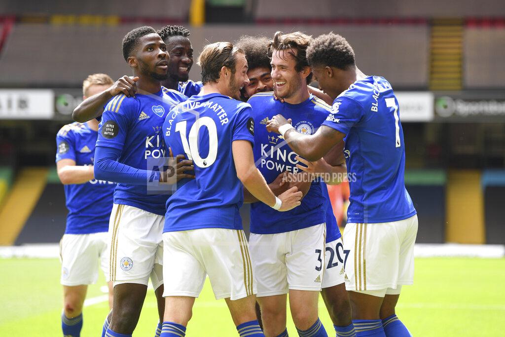 Andy Rain Leicester's Ben Chilwell, center right, celebrates after scoring his side's opening goal during the English Premier League soccer match between Watford and Leicester City at the Vicarage Road Stadium in Watford, England, Saturday, June 20, 2020. (Andy Rain/Pool via AP)