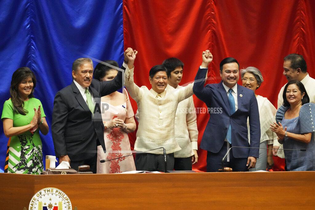 Aaron Favila President-elect Ferdinand 'Bongbong" Marcos Jr., 4th from left, poses beside, from left, Senator Imee Marcos, Senate President Vicente Sotto III, Imelda Marcos, House Speaker Lord Allan Velasco, Irene Marcos, Maria Louise Marcos and House Majority leader Ferdinand Martin Romualdez, during his proclamation ceremony at the House of Representatives, Quezon City, Philippines on Wednesday, May 25, 2022. Marcos Jr. was proclaimed the next president of the Philippines by a joint session of Congress Wednesday in an astonishingly huge electoral triumph 36 years after his father was ousted as a brutal dictator by a pro-democracy uprising. (AP Photo/Aaron Favila)