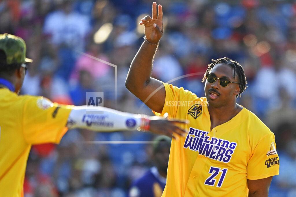 David Dermer Cleveland Browns defense end Myles Garrett celebrates after hitting a home run during the Jarvis Landry Celebrity Softball game Saturday, June 12, 2021, in Eastlake, Ohio. (AP Photo/David Dermer)