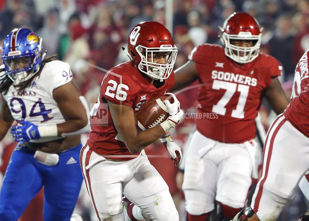 Alonzo Adams Oklahoma running back Kennedy Brooks (26) runs against Kansas during the second half of an NCAA college football game in Norman, Okla., Saturday, Nov. 17, 2018. Oklahoma won 55-40. (AP Photo/Alonzo Adams)