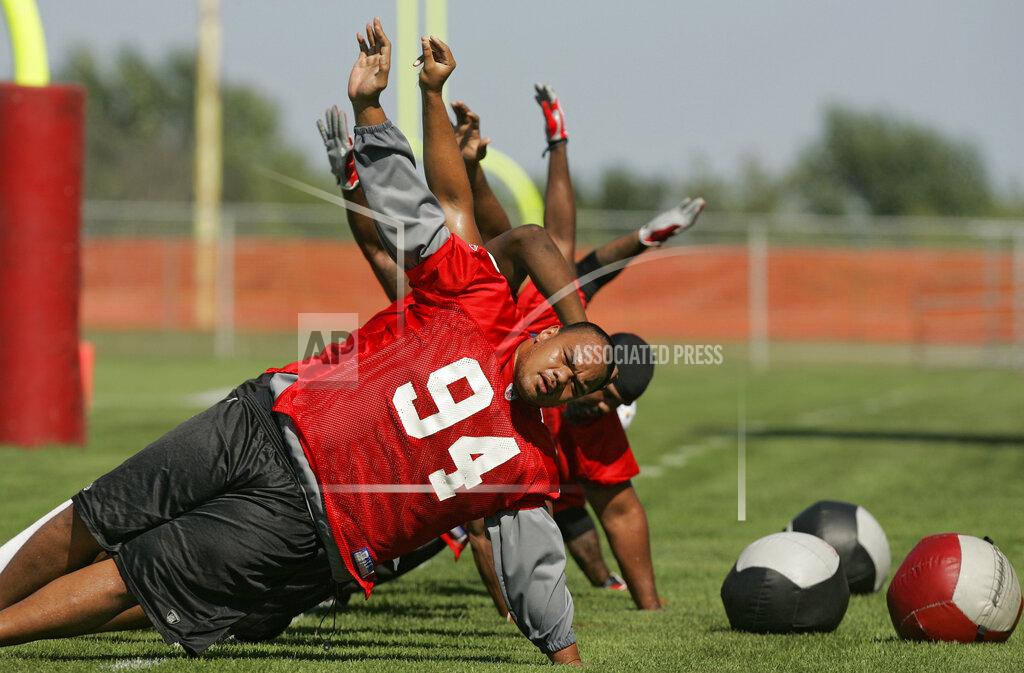 David Eulitt In this July 31, 2006, file photo, Kansas City Chiefs defensive tackle Junior Siavii works out at the team's NFL training camp in River Falls, Wisc. A former defensive tackle for the Kansas City Chiefs, Dallas Cowboys and Seattle Seahawks has been charged with illegally possessing firearms. The U.S. attorney's office said Monday, Aug. 26, 2019, in announcing the charges against 40-year-old Saousoalii Siavii Jr. that he was twice stunned with a Taser after he resisted arrest when he was taken into custody in August.The confrontation began after he was spotted getting out of a vehicle that had been reported stolen. Prosecutors say he fought off officers in the Kansas City suburb of Independence before he was restrained. (David Eulitt/The Kansas City Star via AP, File)