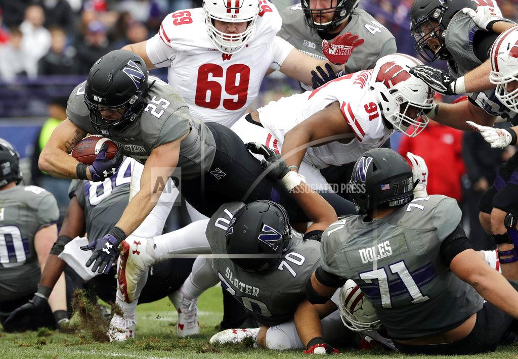 Nam Y. Huh Northwestern running back Isaiah Bowser (25) scores a touchdown against Wisconsin during the second half of an NCAA college football game in Evanston, Ill., Saturday, Oct. 27, 2018. Northwestern won 31-17. (AP Photo/Nam Y. Huh)