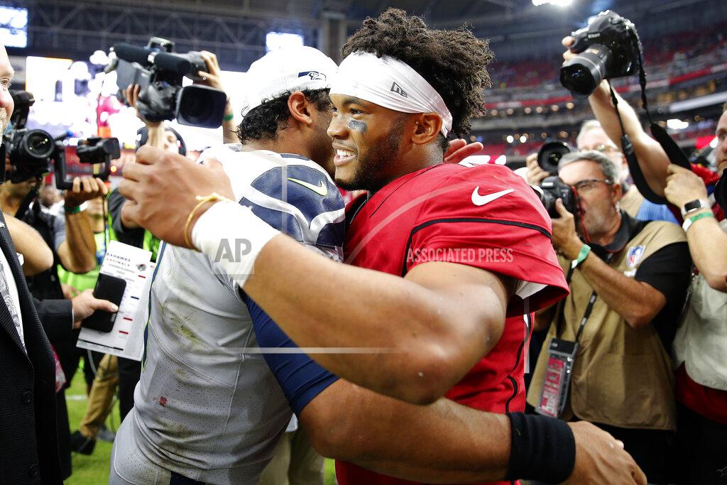 Rick Scuteri Seattle Seahawks quarterback Russell Wilson, left, and Arizona Cardinals quarterback Kyler Murray meet after an NFL football game, Sunday, Sept. 29, 2019, in Glendale, Ariz. The Seahawks won 27-10. (AP Photo/Rick Scuteri)