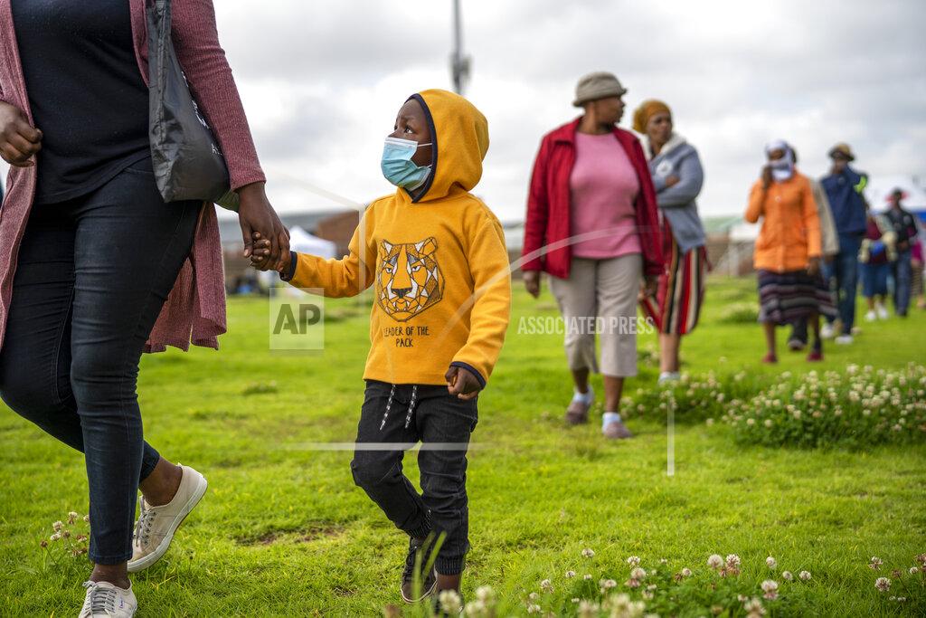 Jerome Delay Residents from the Alexandra township in Johannesburg gather in a stadium to be tested for COVID-19 Monday, April 26, 2020. South Africa will began a phased easing of its strict lockdown measures on May 1, although its confirmed cases of coronavirus continue to increase. (AP Photo/Jerome Delay)