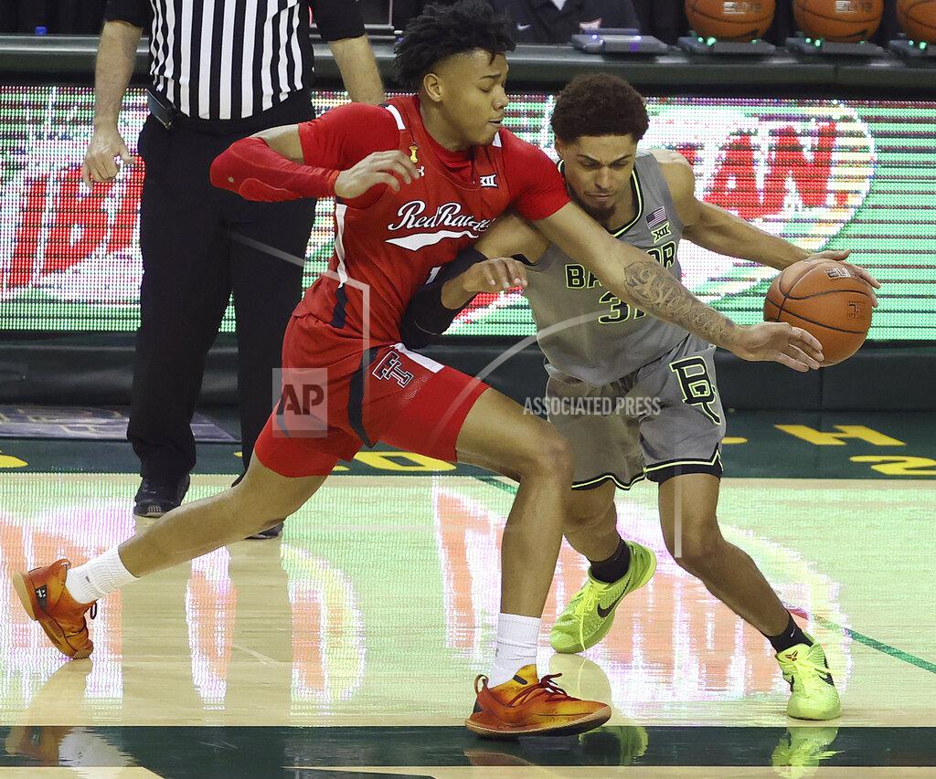 Jerry Larson Baylor guard MaCio Teague (31) drives the ball against Texas Tech guard Terrence Shannon Jr. (1) in the second half of an NCAA college basketball game Sunday, March 7, 2021, in Waco, Texas. (AP Photo/Jerry Larson)