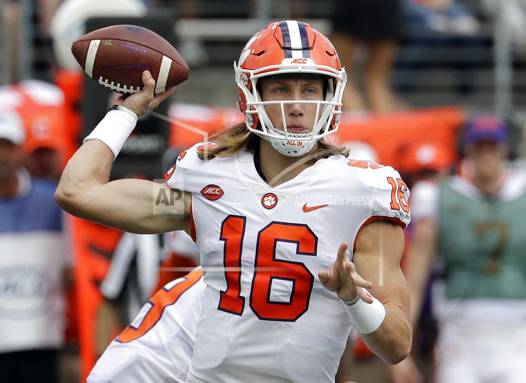 Chuck Burton Clemson's Trevor Lawrence (16) looks to pass against Wake Forest during the first half of an NCAA college football game in Charlotte, N.C., Saturday, Oct. 6, 2018. (AP Photo/Chuck Burton)