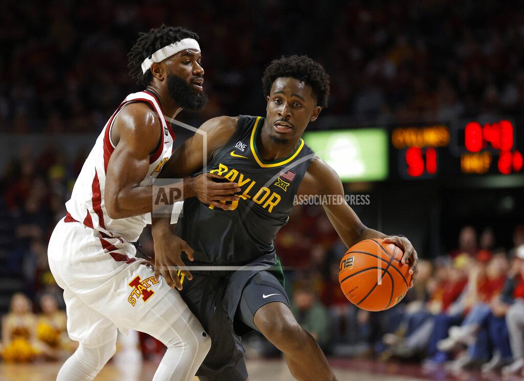 Matthew Putney Iowa State guard Tre Jackson (3) fouls Baylor guard Adam Flagler (10) during the second half of an NCAA college basketball game, Saturday, Jan. 1, 2022, in Ames, Iowa. Baylor won 77-72. (AP Photo/Matthew Putney)