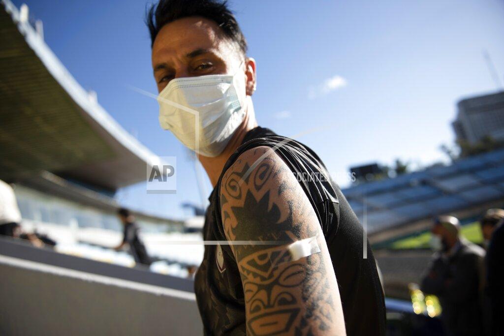 Matilde Campodonico Soccer player Fabian Estoyanoff waits in observation after getting a shot of the Sinovac vaccine for COVID-19 at Centenario Stadium in Montevideo, Uruguay, Thursday, May 6, 2021. (AP Photo/Matilde Campodonico)