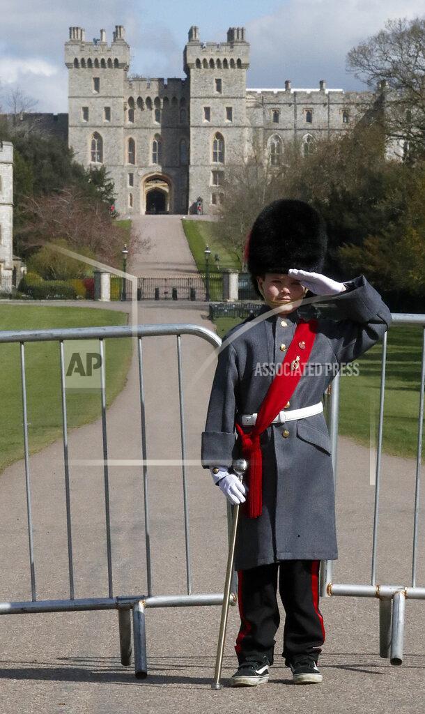 Frank Augstein Seven year old Max Taylor poses at the Long Walk at Windsor Castle in Windsor, England, Thursday, April 15, 2021. Britain's Prince Philip, husband of Queen Elizabeth II, died Friday April 9 aged 99. His funeral service will take place on Saturday at Windsor Castle. (AP Photo/Frank Augstein)