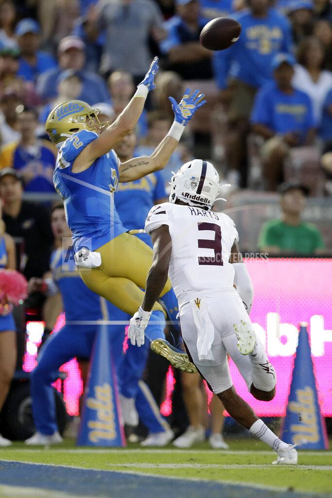 Marcio Jose Sanchez UCLA wide receiver Kyle Philips, left, catches a touchdown in front of Arizona State defensive back Willie Harts (3) during the first half of an NCAA college football game Saturday, Oct. 26, 2019, in Pasadena, Calif. (AP Photo/Marcio Jose Sanchez)