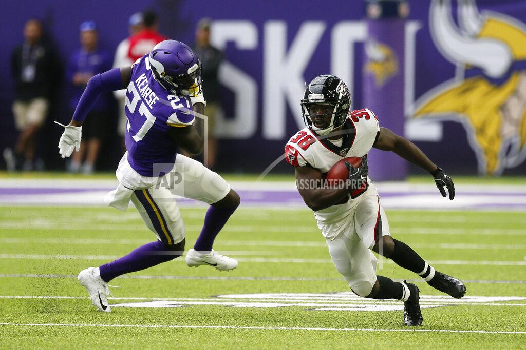 Jim Mone Atlanta Falcons running back Kenjon Barner (38) runs from Minnesota Vikings safety Jayron Kearse (27) during the first half of an NFL football game Sunday, Sept. 8, 2019, in Minneapolis. (AP Photo/Jim Mone)