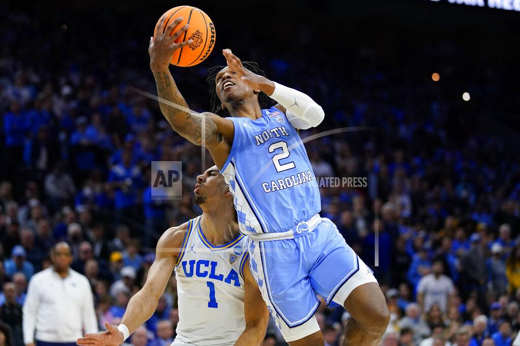 Matt Rourke North Carolina's Caleb Love, right, goes up for shot against UCLA's Jules Bernard during the second half of a college basketball game in the Sweet 16 round of the NCAA tournament, Friday, March 25, 2022, in Philadelphia. (AP Photo/Matt Rourke)
