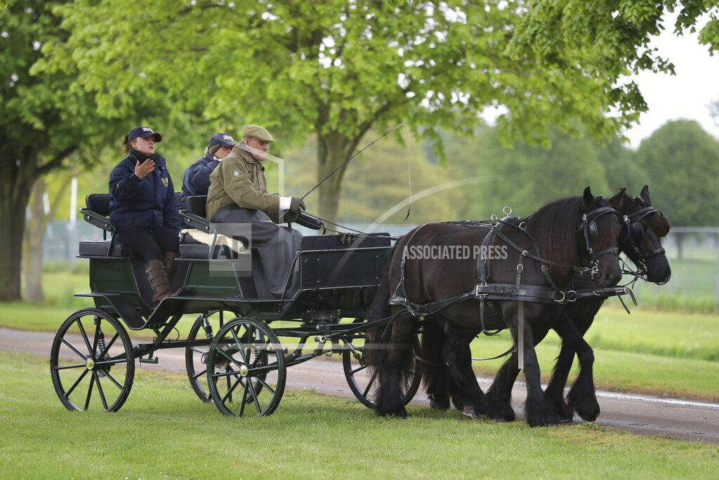 Andrew Matthews FILE - In this May 9, 2019 file photo, Britain's Prince Philip drives a carriage during the Royal Windsor Horse Show in Windsor, England. The Duke's love of carriage-driving is to be a central feature of his funeral on Saturday when the carriage and his two Fell ponies, Balmoral Nevis and Notlaw Storm, will be present in the Quadrangle of Windsor Castle during the procession. (Andrew Matthews/PA via AP)