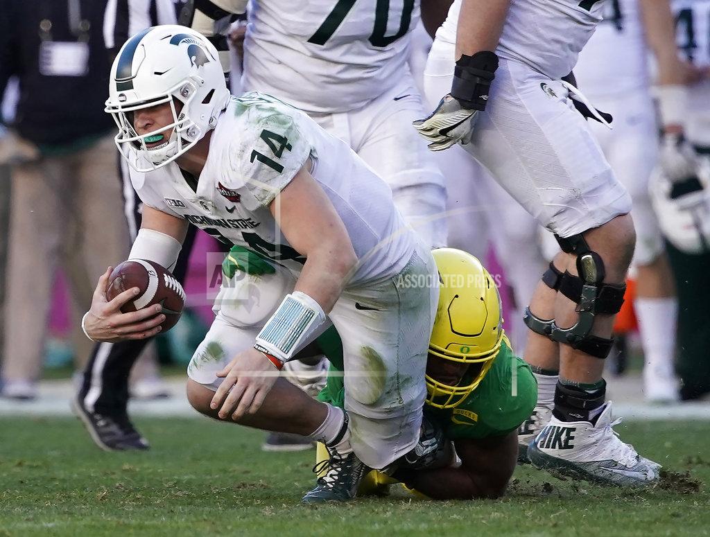 Tony Avelar Michigan State quarterback Brian Lewerke (14) is sacked by Oregon linebacker Justin Hollins (11) during the second half of the Redbox Bowl NCAA college football game Monday, Dec. 31, 2018, in Santa Clara, Calif. (AP Photo/Tony Avelar)