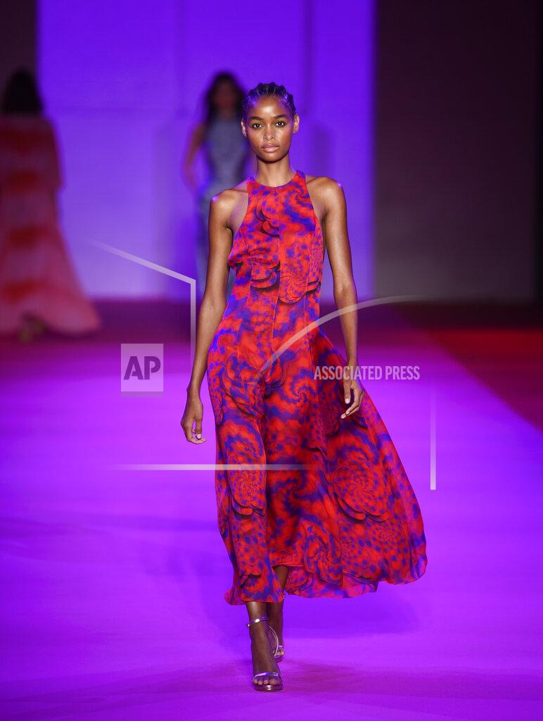 Evan Agostini A model walks the runway at the Brandon Maxwell spring/summer 2022 fashion show in the Brooklyn borough of New York during Fashion Week on Friday, Sept. 10, 2021. (Photo by Evan Agostini/Invision/AP)