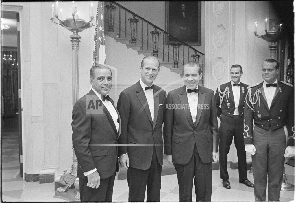 Uncredited In this Nov. 4, 1969, image provided by The Richard Nixon Library & Museum, President Richard Nixon, center, stands with Prince Philip, second from left, prior to a black tie state dinner. (The Richard Nixon Library & Museum via AP)