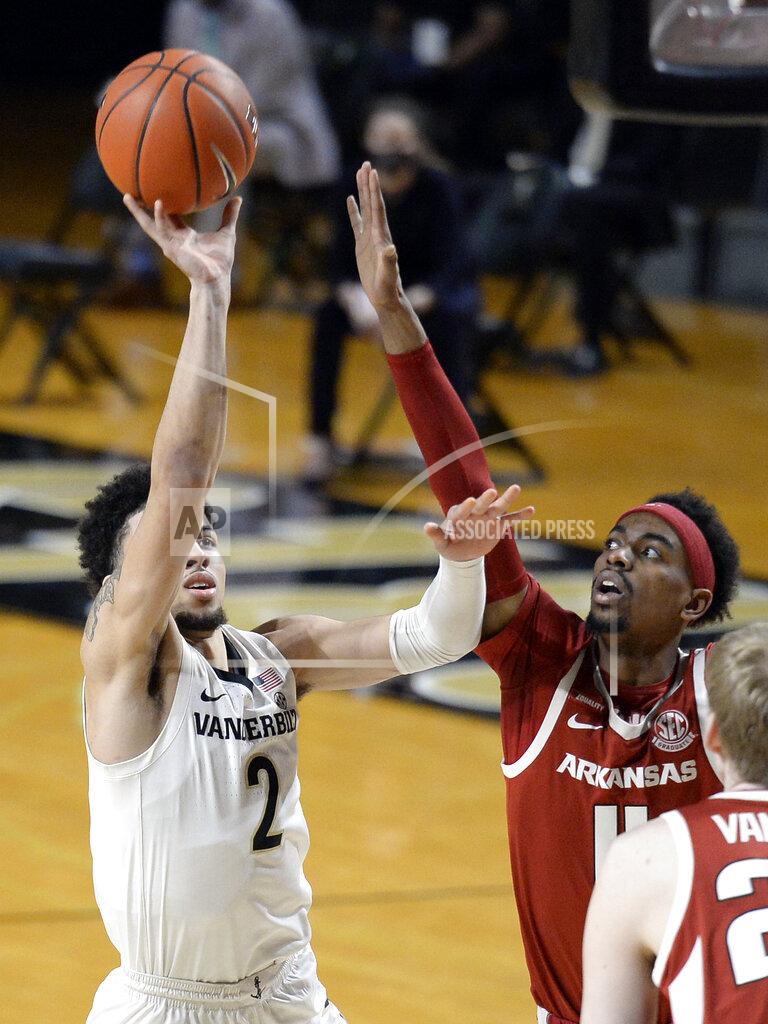 Mark Zaleski Vanderbilt guard Scotty Pippen Jr. (2) shoots against Arkansas guard Jalen Tate (11) during the first half of an NCAA college basketball game Saturday, Jan. 23, 2021, in Nashville, Tenn. (AP Photo/Mark Zaleski)